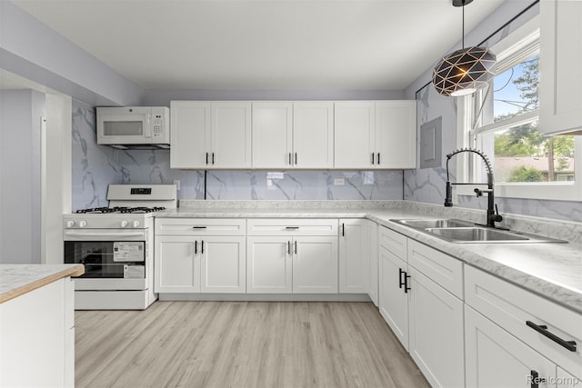 33420 Bentley Ct, Westland, MI 48186 - kitchen with white appliances, white cabinets, and light countertops