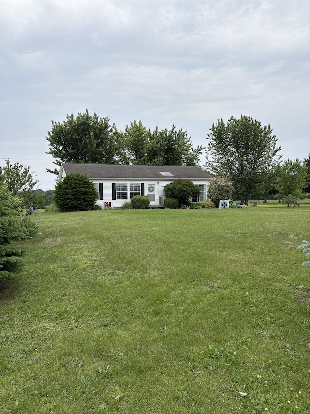 9233 Gary Rd, Chesaning, MI 48616 - ranch-style home featuring a front lawn