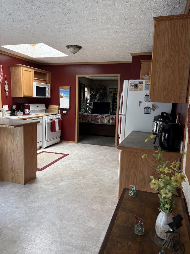 9233 Gary Rd, Chesaning, MI 48616 - kitchen featuring white appliances and a textured ceiling