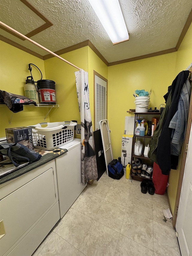 9233 Gary Rd, Chesaning, MI 48616 - laundry room featuring washing machine and clothes dryer, ornamental molding, and a textured ceiling