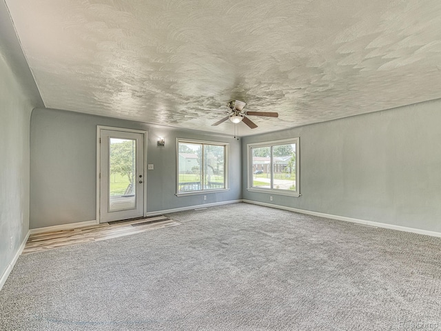1309 Wood St, Monroe, MI 48161 - carpeted spare room featuring a ceiling fan and a textured ceiling