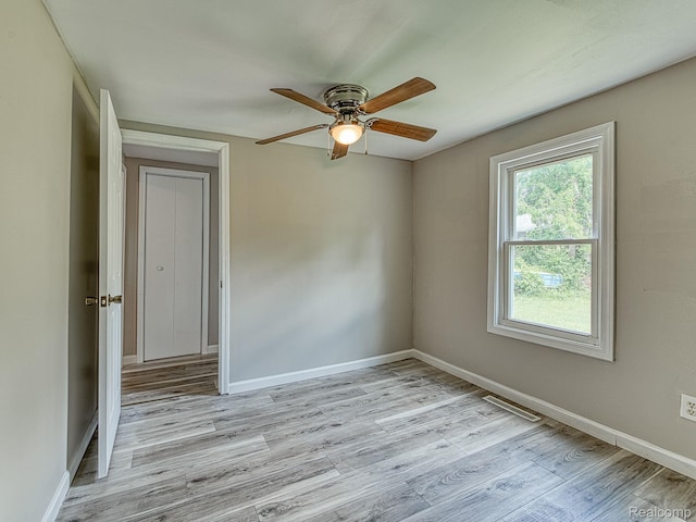 1309 Wood St, Monroe, MI 48161 - empty room featuring ceiling fan and light wood finished floors