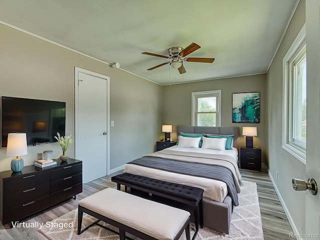 1309 Wood St, Monroe, MI 48161 - bedroom featuring wood finished floors, a ceiling fan, and ornamental molding