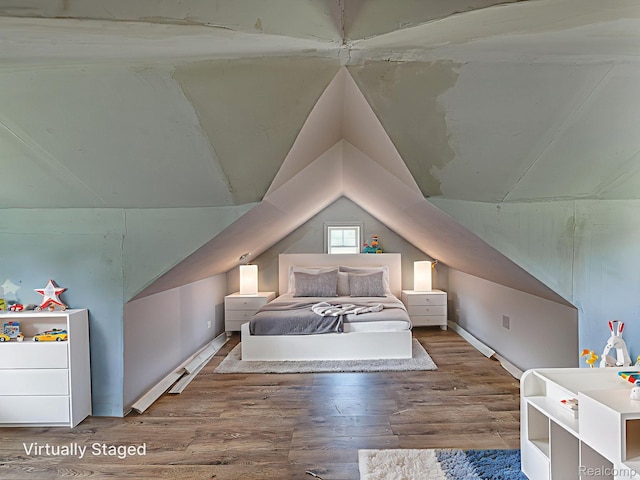 1309 Wood St, Monroe, MI 48161 - bedroom with vaulted ceiling and wood finished floors