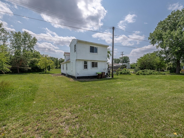 1309 Wood St, Monroe, MI 48161 - view of side of home featuring a yard