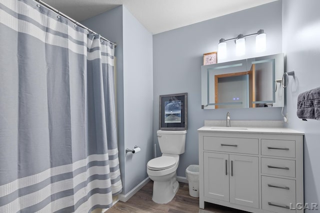 838 Stetson St, Tecumseh, MI 49286 - full bath featuring wood finished floors, vanity, and curtained shower