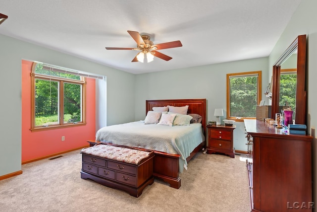 838 Stetson St, Tecumseh, MI 49286 - bedroom with light colored carpet and ceiling fan