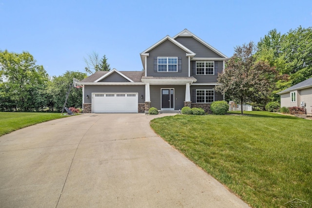 11619 Saddlebrook Cir, Freeland, MI 48623 - view of front of property with stone siding, driveway, an attached garage, and a front lawn