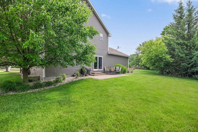 11619 Saddlebrook Cir, Freeland, MI 48623 - view of grassy yard with a patio area and entry steps