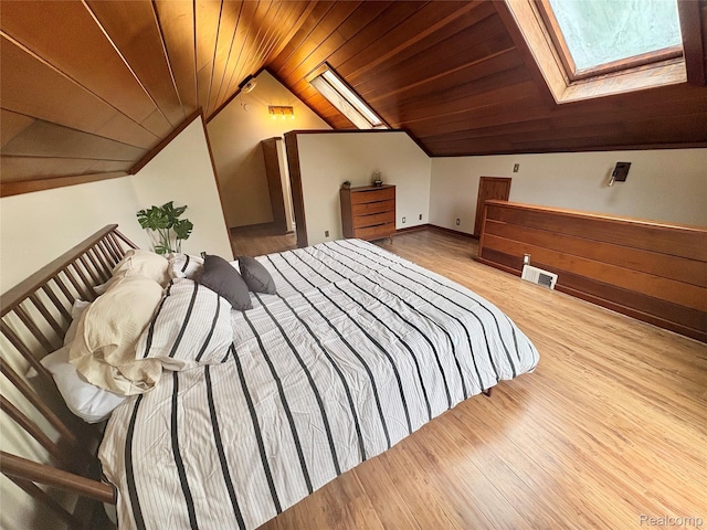 7073 N Linden Rd, Mount Morris, MI 48458 - bedroom featuring a skylight, wood ceiling, lofted ceiling, and wood finished floors