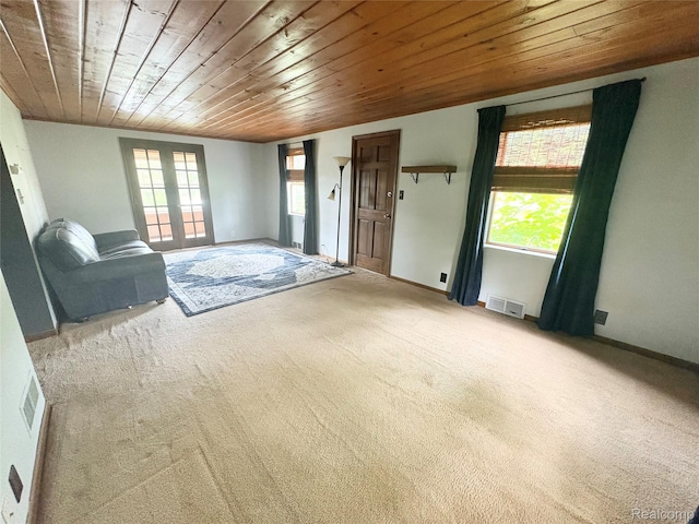 7073 N Linden Rd, Mount Morris, MI 48458 - unfurnished living room featuring french doors, wooden ceiling, and carpet floors