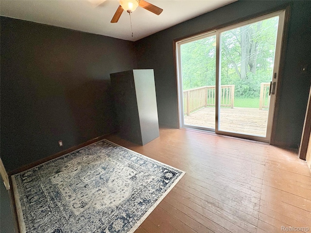 7073 N Linden Rd, Mount Morris, MI 48458 - unfurnished room featuring ceiling fan and hardwood / wood-style floors