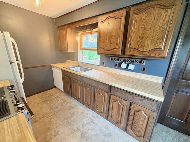 7073 N Linden Rd, Mount Morris, MI 48458 - kitchen featuring dishwasher, light countertops, stove, and brown cabinets