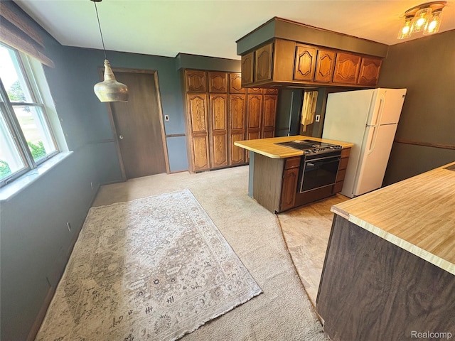 7073 N Linden Rd, Mount Morris, MI 48458 - kitchen featuring stove, freestanding refrigerator, light countertops, decorative light fixtures, and light colored carpet