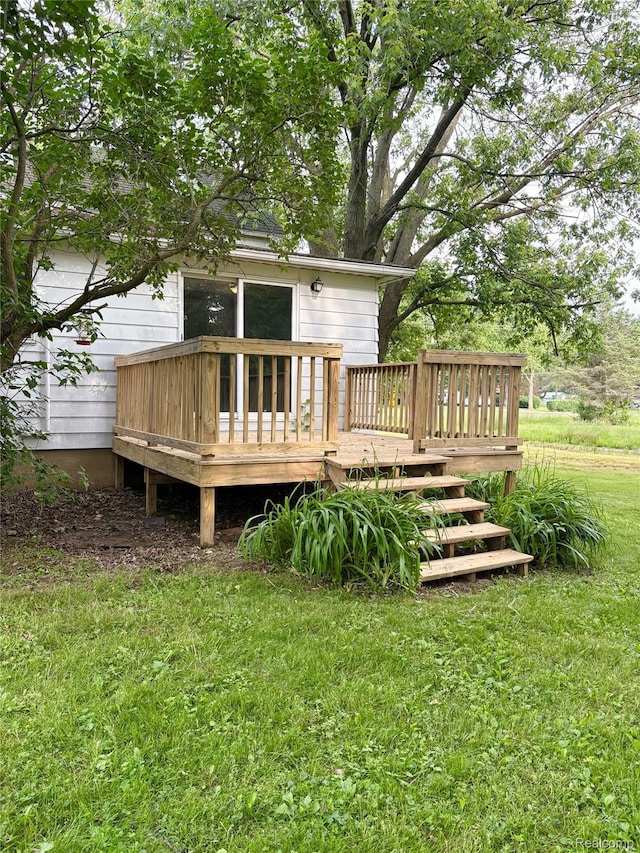 7073 N Linden Rd, Mount Morris, MI 48458 - back of property with a deck and a yard