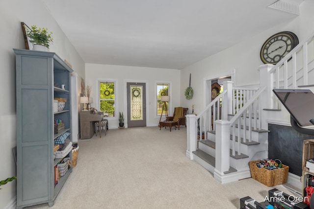 307 N Jefferson St SE, Lowell, MI 49331 - sitting room with stairs and carpet flooring
