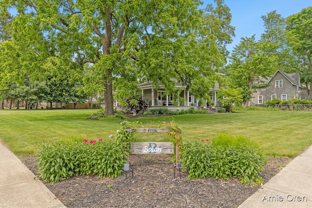 307 N Jefferson St SE, Lowell, MI 49331 - view of grassy yard with covered porch