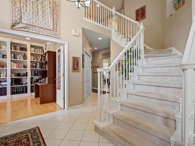 7304 Colchester Ln, West Bloomfield, MI 48322 - foyer entrance with a high ceiling, tile patterned floors, and stairs