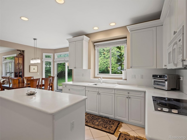7304 Colchester Ln, West Bloomfield, MI 48322 - kitchen featuring white appliances, light countertops, recessed lighting, white cabinetry, and decorative light fixtures