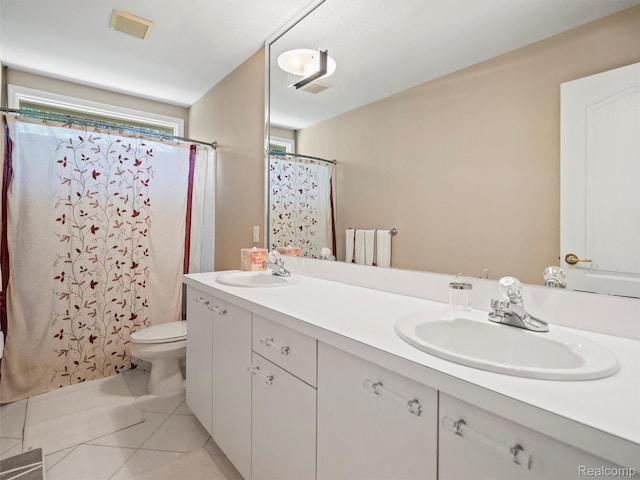7304 Colchester Ln, West Bloomfield, MI 48322 - bathroom with double vanity, tile patterned floors, and a shower with shower curtain