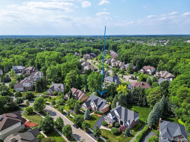 7304 Colchester Ln, West Bloomfield, MI 48322 - aerial perspective of suburban area with a heavily wooded area and property boundaries highlighted