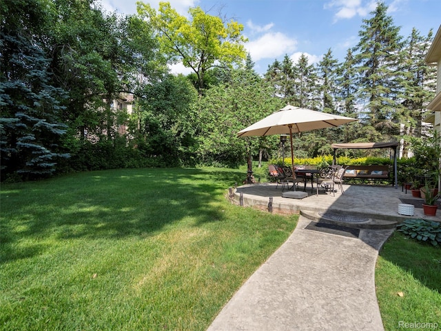 7304 Colchester Ln, West Bloomfield, MI 48322 - view of grassy yard featuring a patio