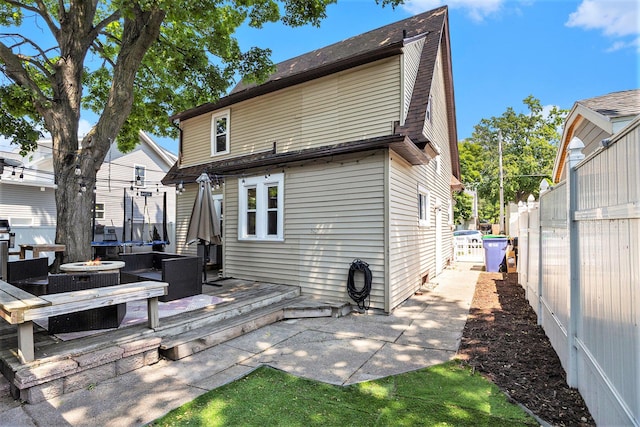 1248 Fisk Rd SE, Grand Rapids, MI 49506 - rear view of property featuring outdoor lounge area and a wooden deck