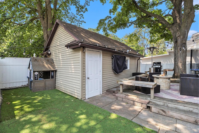 1248 Fisk Rd SE, Grand Rapids, MI 49506 - view of outdoor structure with a fire pit