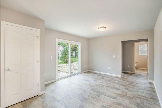 16377 Mitchell Crk Trl, Big Rapids, MI 49307 - empty room featuring light wood-style flooring and baseboards