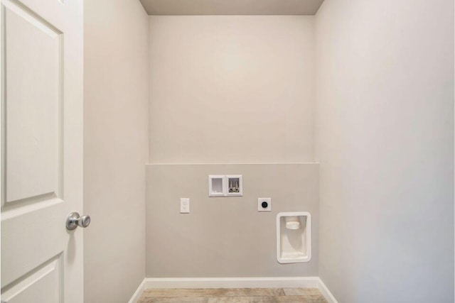 16377 Mitchell Crk Trl, Big Rapids, MI 49307 - laundry room featuring hookup for an electric dryer, baseboards, and hookup for a washing machine