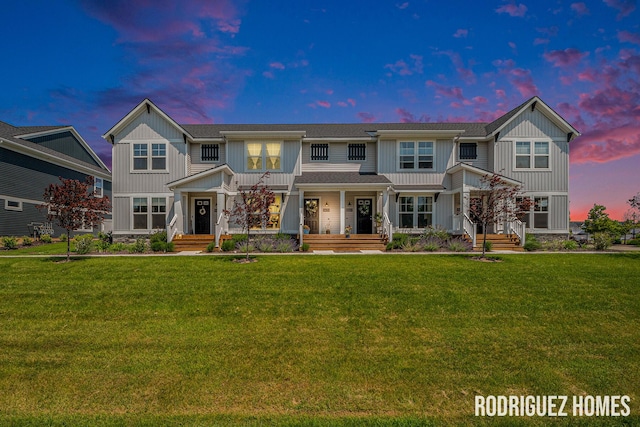6678 S Square Ln, Rockford, MI 49341 - view of front facade featuring a porch, board and batten siding, and a yard