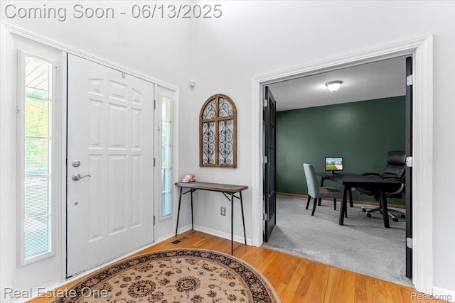 26957 Blue Heron Dr, Flat Rock, MI 48134 - foyer entrance featuring light wood finished floors and baseboards