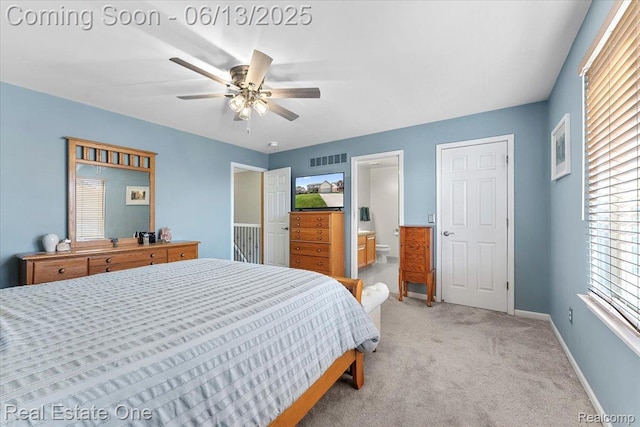 26957 Blue Heron Dr, Flat Rock, MI 48134 - bedroom with light colored carpet, ensuite bath, and a ceiling fan