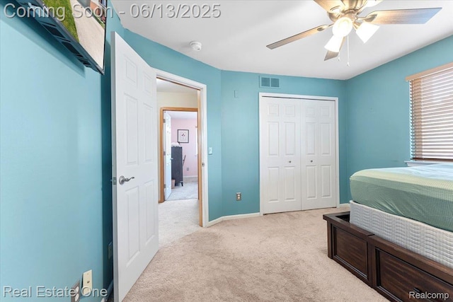 26957 Blue Heron Dr, Flat Rock, MI 48134 - bedroom featuring light colored carpet, a closet, and a ceiling fan