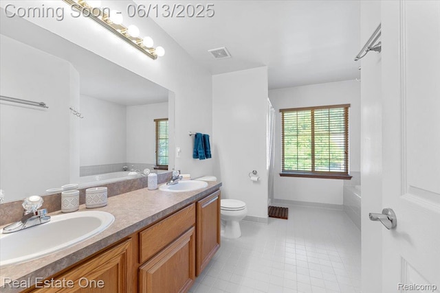 26957 Blue Heron Dr, Flat Rock, MI 48134 - full bathroom with a garden tub, double vanity, and tile patterned flooring