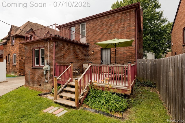 3924 Yorkshire Rd, Detroit, MI 48224 - rear view of property featuring brick siding, a deck, and a balcony