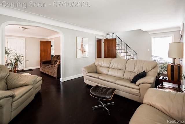 3924 Yorkshire Rd, Detroit, MI 48224 - living room featuring arched walkways, stairway, and dark wood-type flooring