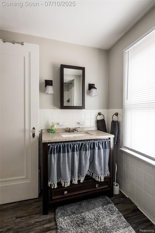 3924 Yorkshire Rd, Detroit, MI 48224 - bathroom with a wainscoted wall, vanity, wood finished floors, and tile walls