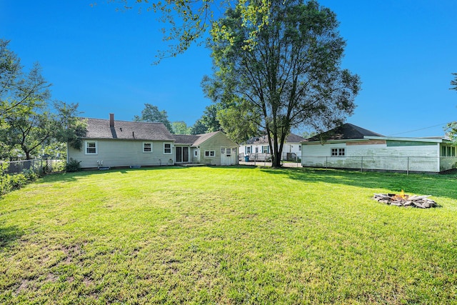 55146 M 51 N, Dowagiac, MI 49047 - fenced backyard featuring a fire pit