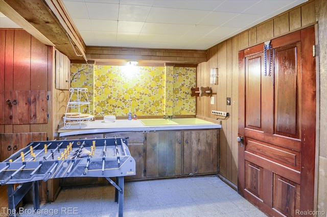 1038 Cora Dr, Flint, MI 48532 - interior space with light floors, wallpapered walls, and wooden walls