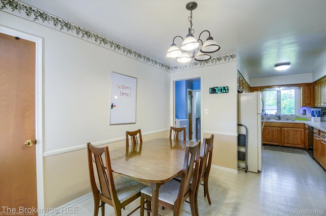 1038 Cora Dr, Flint, MI 48532 - dining area with a chandelier and baseboards