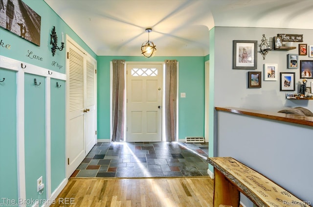 1038 Cora Dr, Flint, MI 48532 - foyer entrance with stone tile flooring and baseboards