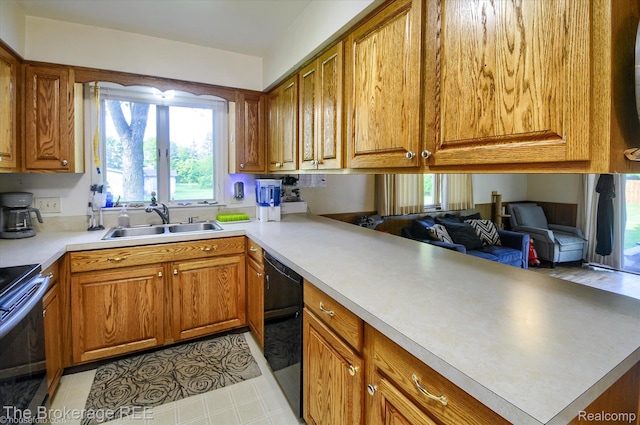 1038 Cora Dr, Flint, MI 48532 - kitchen with stainless steel range with electric cooktop, black dishwasher, brown cabinets, and open floor plan