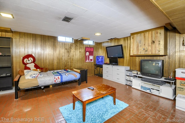 1038 Cora Dr, Flint, MI 48532 - bedroom with wood walls and brick floors