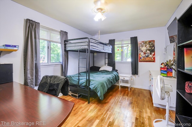 1038 Cora Dr, Flint, MI 48532 - bedroom with wood finished floors and baseboards