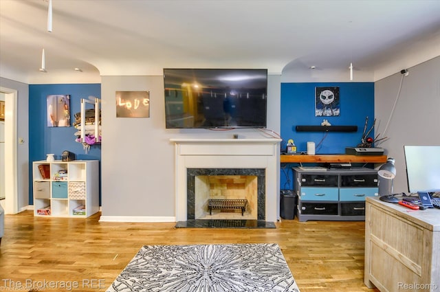1038 Cora Dr, Flint, MI 48532 - living area with wood finished floors and a premium fireplace