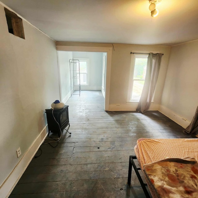 212 W Ash St, Albion, MI 49224 - hallway with plenty of natural light and wood-type flooring