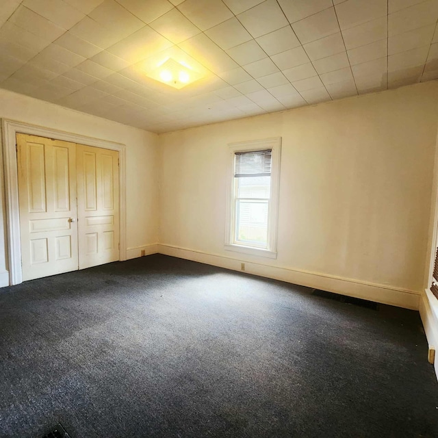 212 W Ash St, Albion, MI 49224 - unfurnished bedroom with carpet flooring and a closet