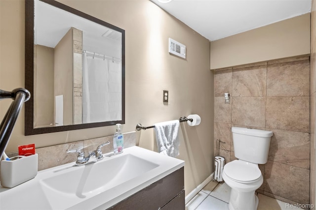 2009 Thomas St, Lincoln Park, MI 48146 - bathroom with vanity, tile walls, and tile patterned floors