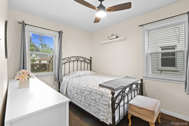 2009 Thomas St, Lincoln Park, MI 48146 - carpeted bedroom with baseboards and a ceiling fan